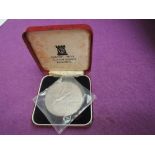 A 1975 Republique Du Senegal Silver 150 Francs coin, weight approx 80g, uncirculated in box