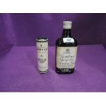 A bottle of Gordon's Special Dry London Gin 13 1/3Fl Ozs 70% proof and a miniature bottle of