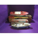 A Sutcliffe tin plate and clockwork Sped Boat in blue and white with red interior, key present, in