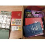 A box of mainly GB and New Zealand coins including year sets and crowns