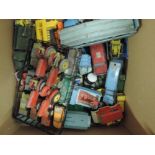 Five boxes of early playworn Dinky and Corgi diecasts including flat wagons, tractors, fire engines,