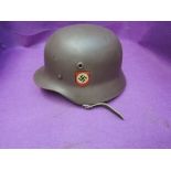 A German WW2 helmet with modern liner and decals