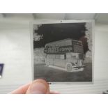 Four albums containing approx 344 reproduction and original black and white negatives of buses,