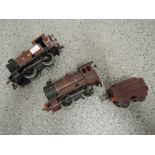 Two Hornby clockwork 0 gauge 0-4-0 LMS Tank Engines, one with tender