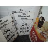 A selection of Westmorland Gazette advertising boards and similar ice cream advert