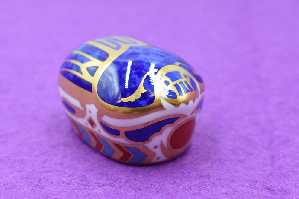A Royal Crown Derby paperweight. Millenium Bug modelled and decoration design by John Ablitt.