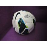 A modern football bearing signatures believed to be from Buttner, Carrick, Evans, De Gea and