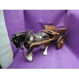 A Melbaware study, Shire horse with harness, pulling a hand made wooden cart