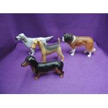 Four Beswick studies, Champion Dogs, Airedale Terrier 962, English Setter 973, Collie 1791 and St