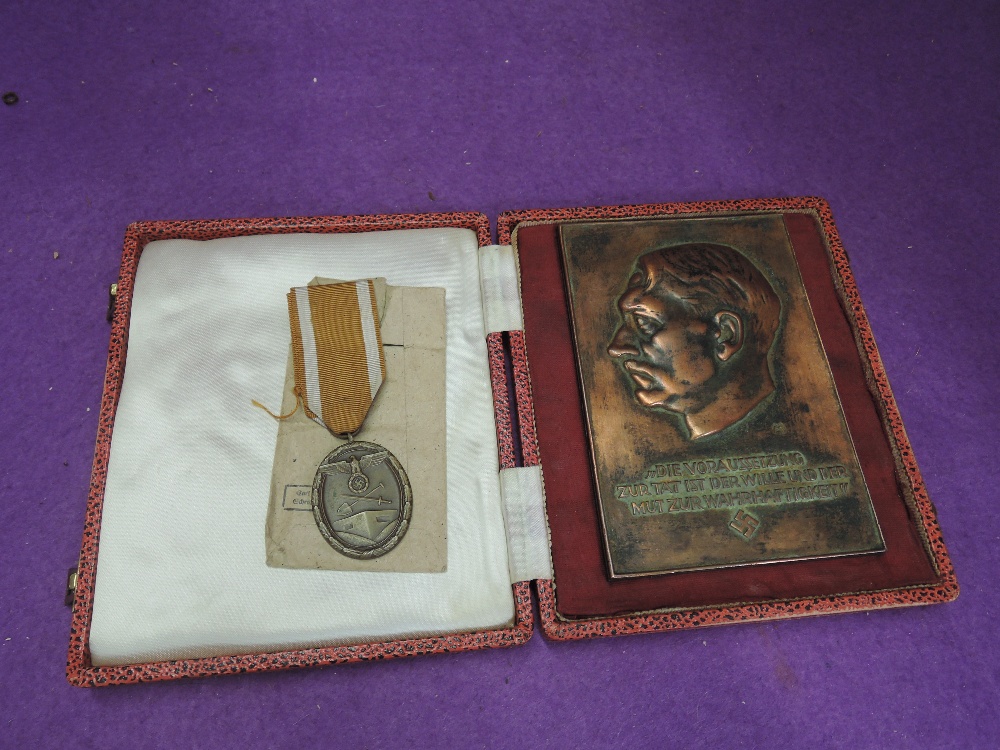 A Adolf Hitler Award Plaque For NSDAP Officials in case with a West Wall medal