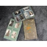 Three vintage postcard albums containing approximately five hundred vintage postcards