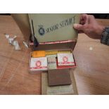 A collection of vintage cigarette cards in album and loose along with two vintage card games