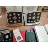 A collection of GB coins including year sets, five pound coins etc