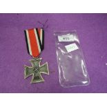 A German WW2 Iron Cross with ribbon 1939/1813