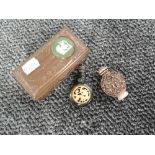 A copper box containing a vintage oriental Opium bottle and a scent bottle