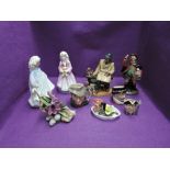 Four Royal Doulton figures, Lunchtime HN2480, Town Crier HN2119, Faith HN3082 and Hope HN3061