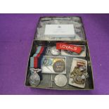 A small collection of medals and cap badges including 1914-1918 medal 12944 GNR G Kelso RA and