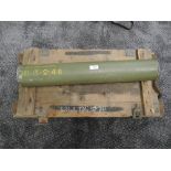 A wooden explosive case with rope handles and three empty 3.6inch rocket containers inside, plus