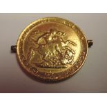 A 1817 George III Gold Sovereign having two small mount lugs on edge, needs viewing