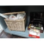 A wicker basket with a large amount of Fly tieing equipment