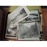 A tin of Postcards including Workington and 1902 Martinique Volcano etc