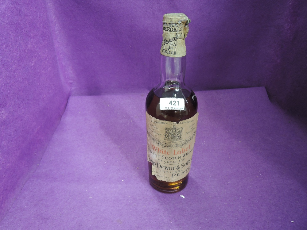 A 1929 bottle of John Dewar and Sons White Label Finest Scotch Whisky of Great Age with spring