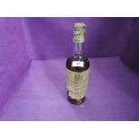 A 1929 bottle of John Dewar and Sons White Label Finest Scotch Whisky of Great Age with spring