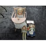 A Tri-ang wooden dolls folding High Chair, four celluloid and cloth dolls along with a miniature