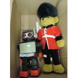 A Merrythought Queens Foot Guard teddy bear along with a modern Chinese battery operated plastic