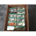 A collection of Twenty Two Corgi Classics diecast Advertising Vans and Sports Cars including Evening