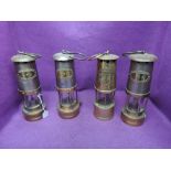 Four miners lamps, E Thomas & Williams Ltd, Aberdare x3 and The Protector, Eccles
