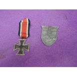 A WW2 German Iron Cross with ribbon and a Crimea Shield