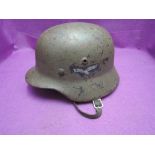 A German WW2 Luftwaffe Helmet with original chin strap and liner