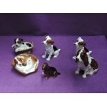 Six Royal Doulton studies, various puppies and a seated Spaniel