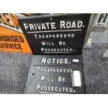 Two cast iron signs for private road and trespassers