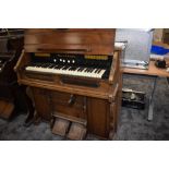 A late stained frame American organ/harmonium of typical chapel design labelled for Mason &