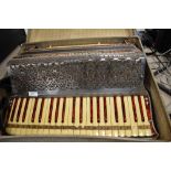 A Scandallio traditional piano accordion in case