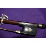 A traditional violin or cello bow, stamped Bausch