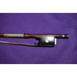 A violin bow, stamped Dodd