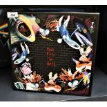 A deluxe cd package of Pink Floyd's ' the Wall ' with many inserts , scarf and mini gig posters ,