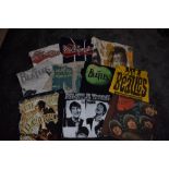 A selection of band t shirts and merchandise for the Beatles