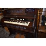 A 19th century stained frame American organ, harmonium of typical chapel design, labelled for 49
