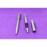 A Parker 25 Flighter fountain pen and ballpoint pen in stainless steel