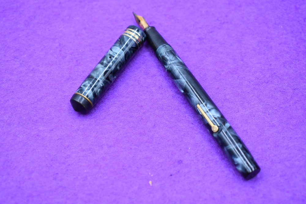 A Conway Stewart 388 fountain pen lever fill in blue marble with one broad and two narrow bands to