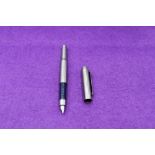 A Parker 25 Flighter fountain pen in stainless steel