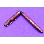 A Conway Stewart 85L fountain pen lever fill, in Rose with Gold Vein, single broad band to cap