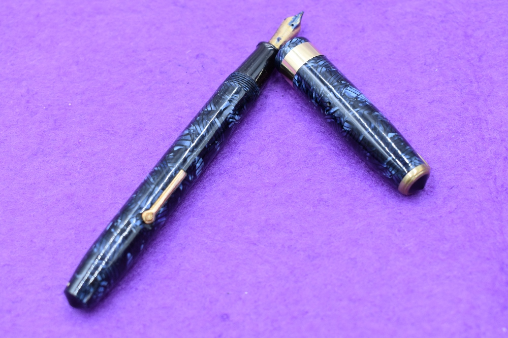 A Conway Stewart 27 fountain pens, lever fill in blue lined pattern, with single broad band to cap