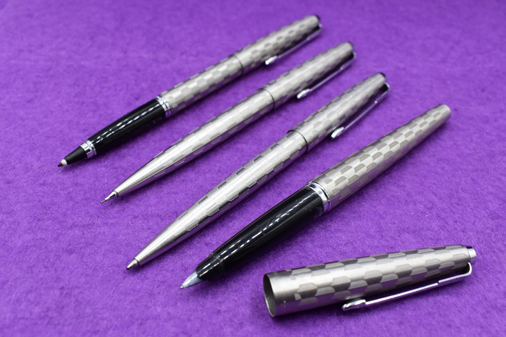 A Parker 45 Harlequin circlet pattern fountain pen, fibre tip ballpoint and propelling pencil