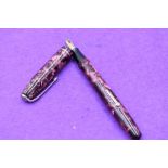 A Conway Stewart 75 fountain pen lever fill in Rose marble, single narrow band