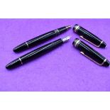 A Montblanc Meisterstruck fountain pen and ballpoint pen set. Black with gold trim in a Waterman